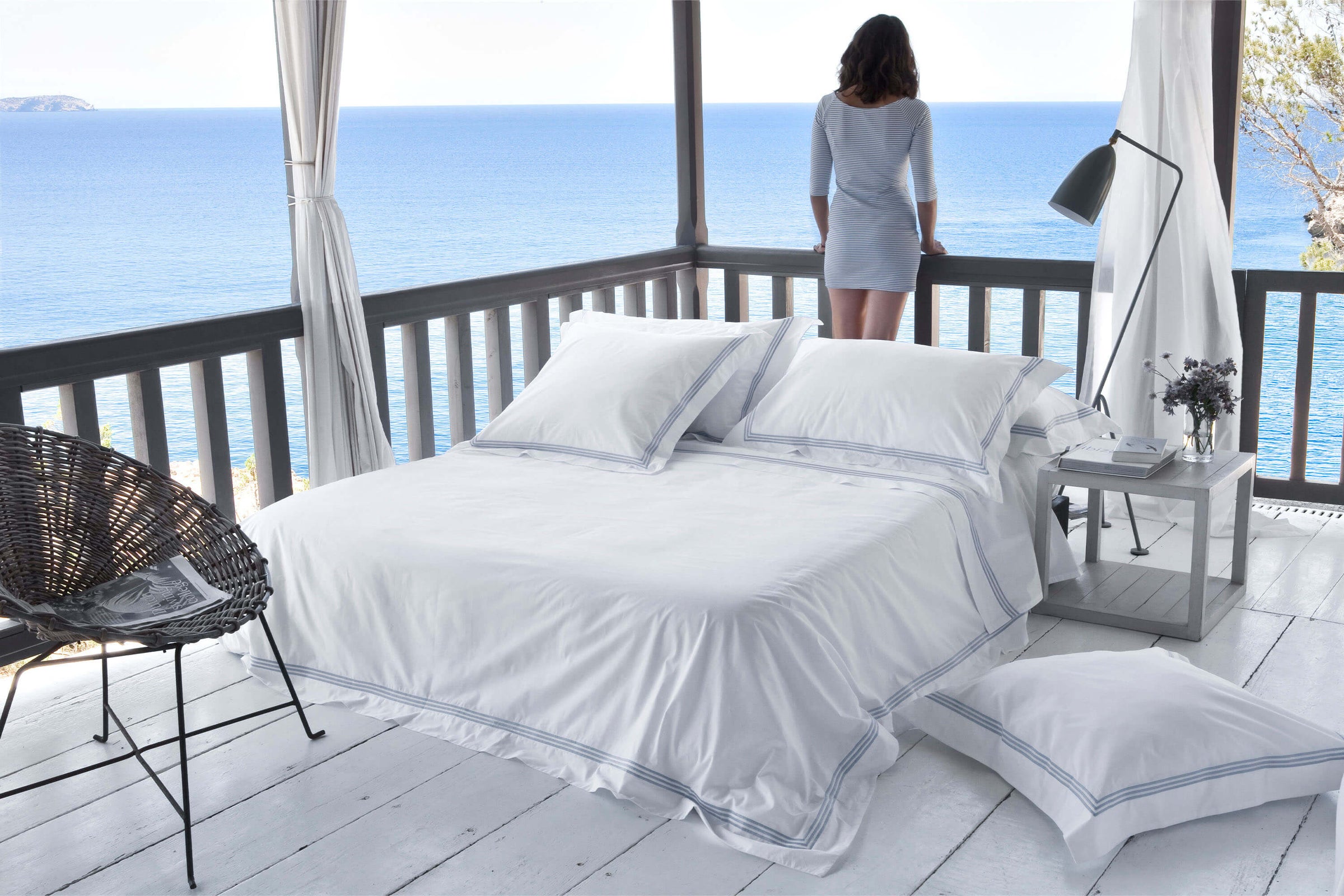 Luxury white percale bedding with triple chord stitch detailing in sky blue